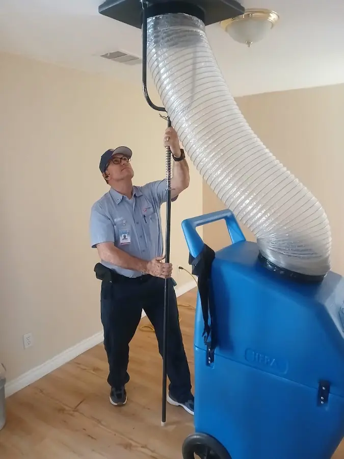Furnace Tune-Up technician using HEPA equipment in Rancho Mission Viejo